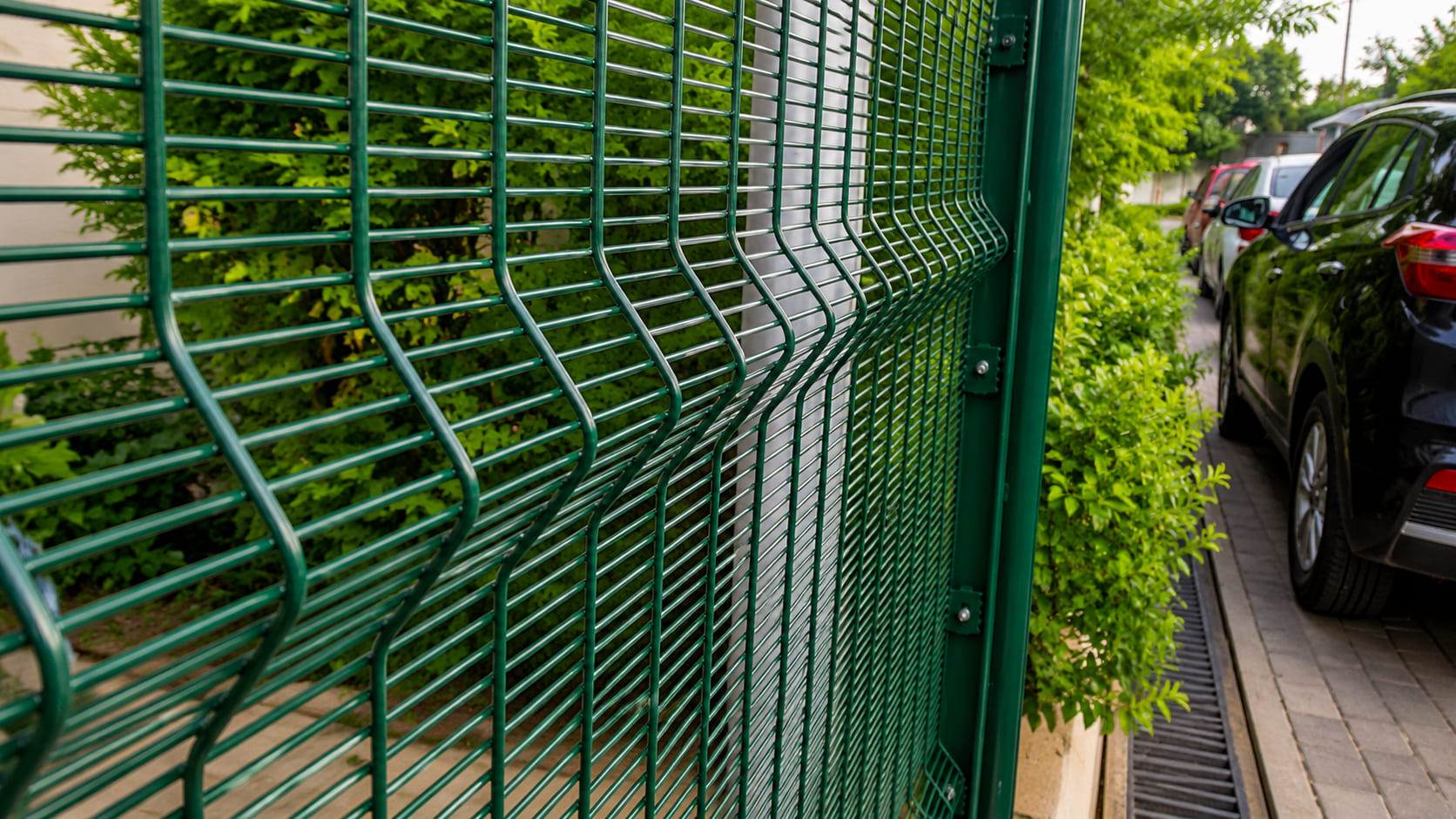 Close-up of a powder-coated 3D welded mesh security fence panel with V-bend reinforcement for durable perimeter protection.