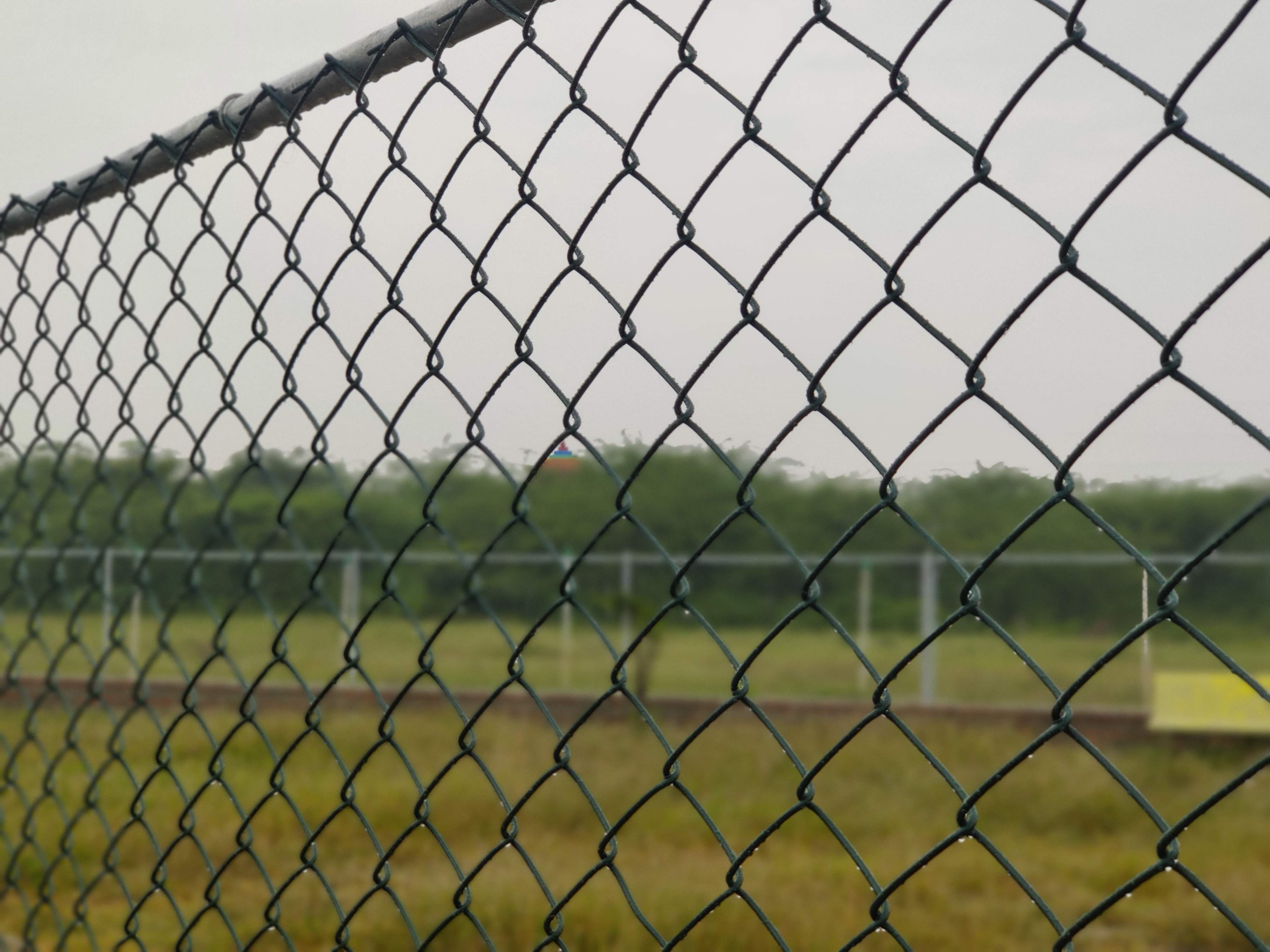 Close-up of a PVC coated galvanized chain link fence mesh designed for durable perimeter security and corrosion resistance.