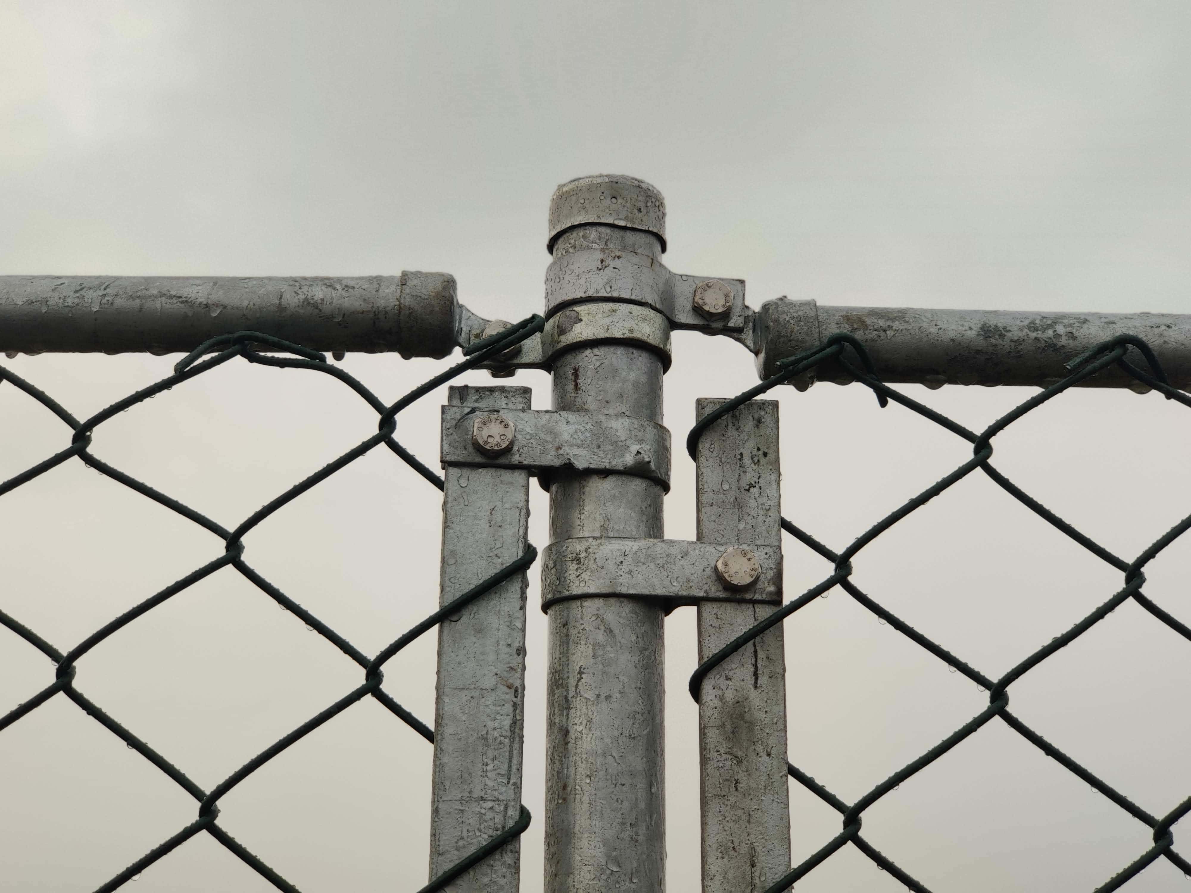 6 feet PVC coated chain link residential fence with PVC coated steel poles for secure home boundary fencing